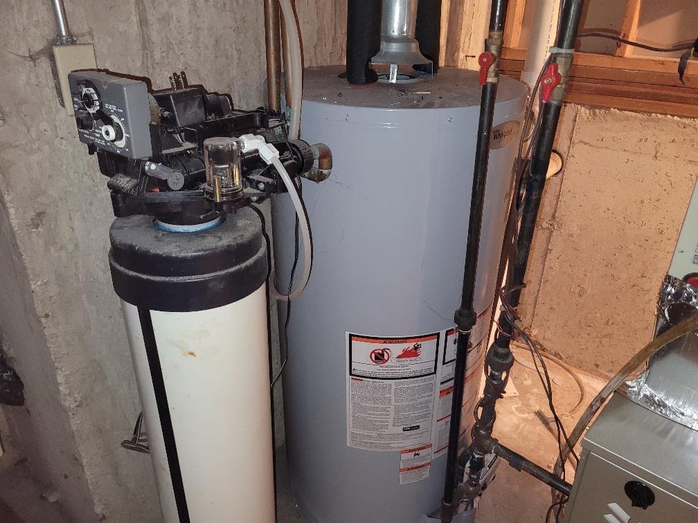 960 South Trainer Road Rockford, IL 61108 - Photo 30 of 31 a close view of water heater and car racks
