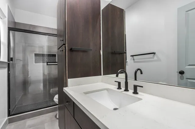 a bathroom with a sink and mirror