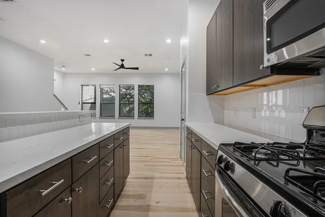 a kitchen with a stove and a sink
