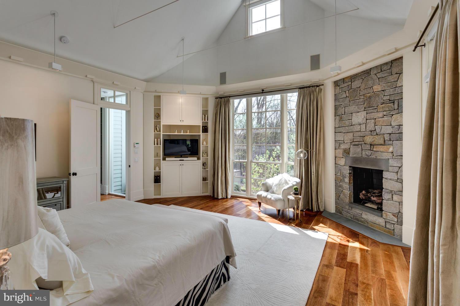 1300 Ranleigh Road McLean, VA 22101 - Photo 13 of 30 a bedroom with a bed and a fireplace