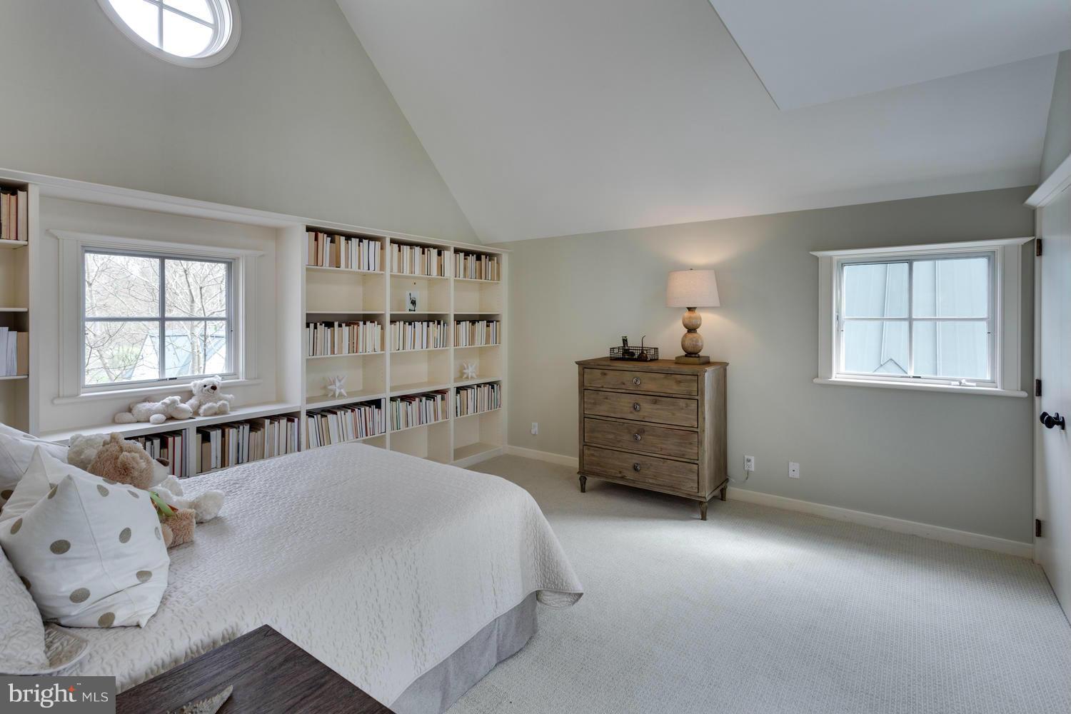 1300 Ranleigh Road McLean, VA 22101 - Photo 18 of 30 a spacious bedroom with a bed and a window