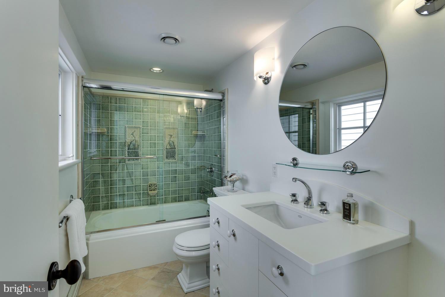 1300 Ranleigh Road McLean, VA 22101 - Photo 19 of 30 a bathroom with a sink a toilet and a mirror