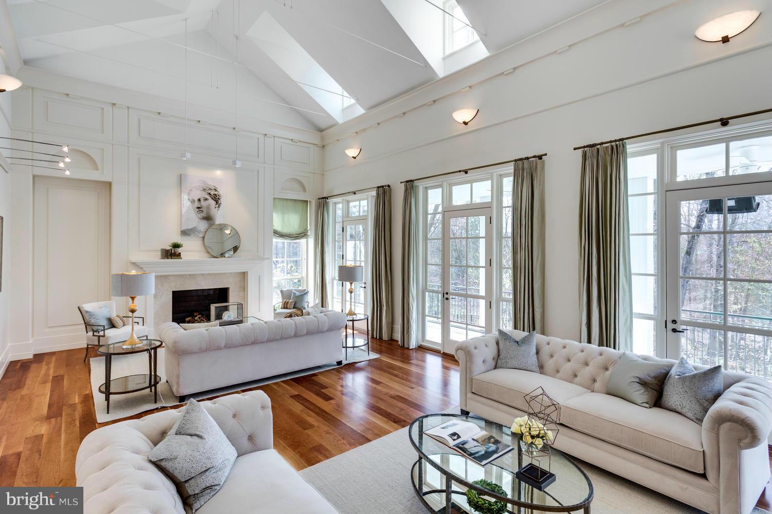 1300 Ranleigh Road McLean, VA 22101 - Photo 3 of 30 a living room with furniture a fireplace and a large window