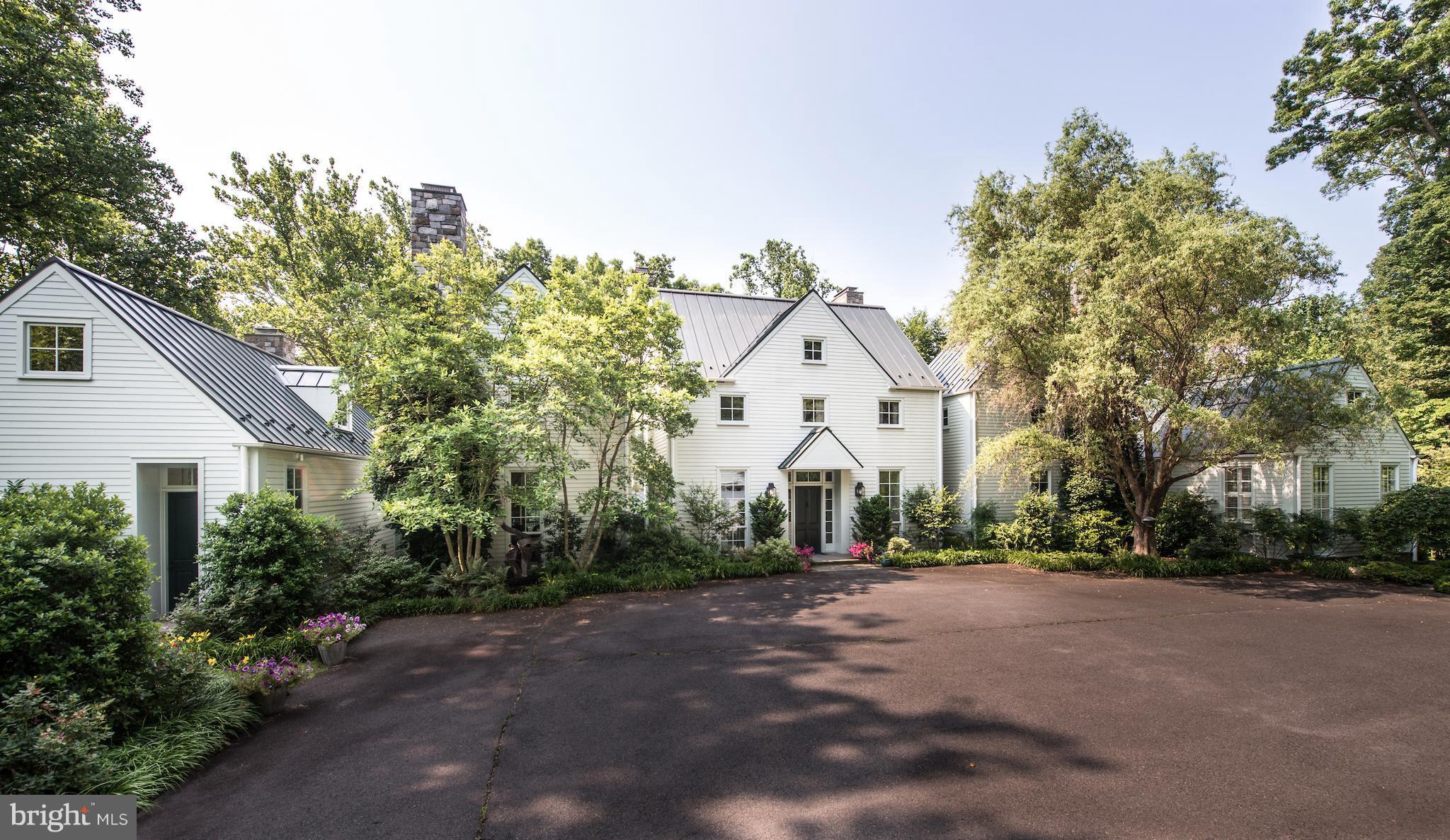 1300 Ranleigh Road McLean, VA 22101 - Photo 28 of 30 a view of a white house with a yard and plants