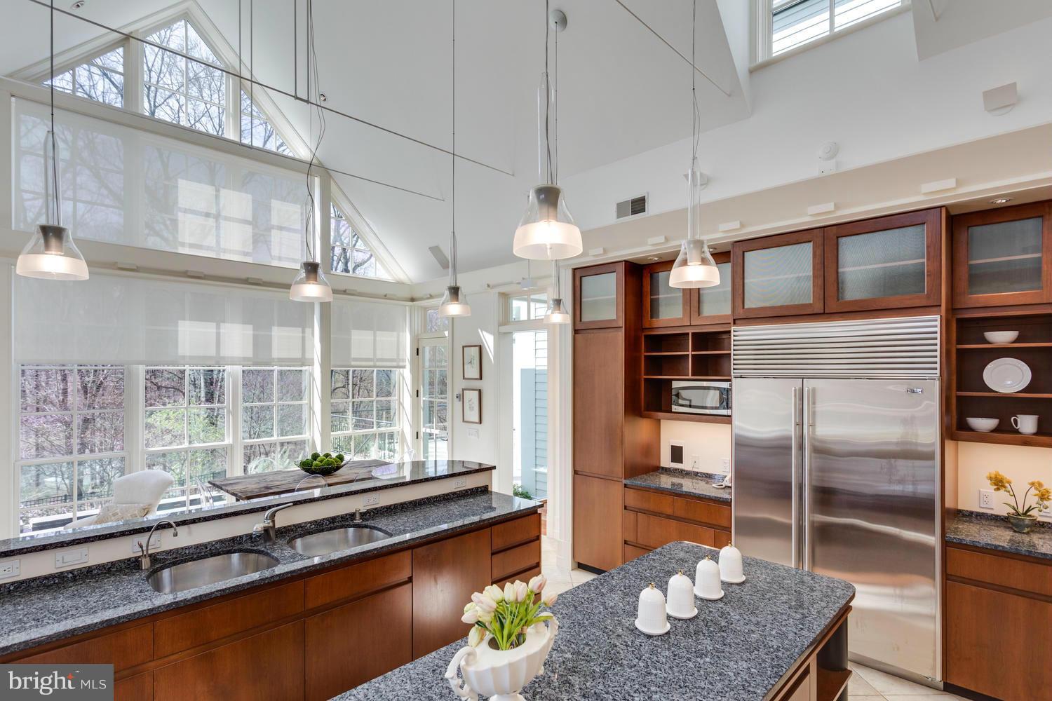 1300 Ranleigh Road McLean, VA 22101 - Photo 7 of 30 a kitchen with stainless steel appliances granite countertop a sink and cabinets