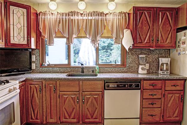 7 Reid Road Chelmsford, MA 01824 - Photo 13 of 30 a kitchen with stainless steel appliances a stove and a microwave