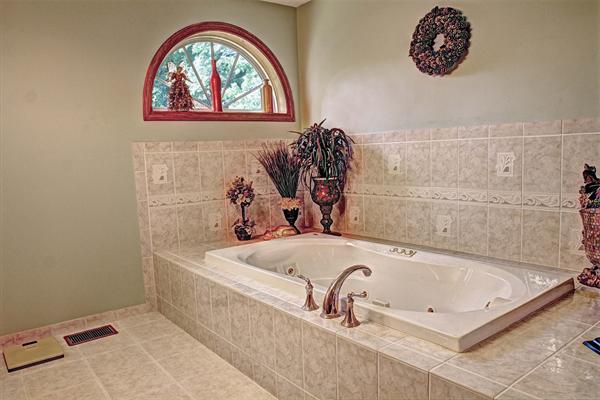 7 Reid Road Chelmsford, MA 01824 - Photo 5 of 30 a bath tub sitting next to a white sink