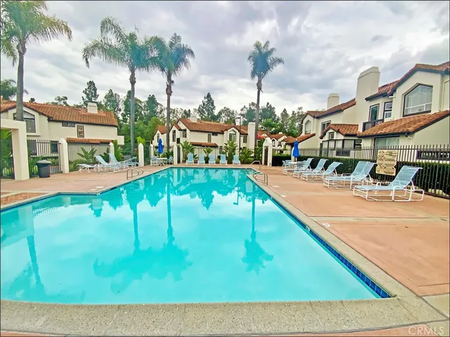 a view of a swimming pool with an outdoor seating
