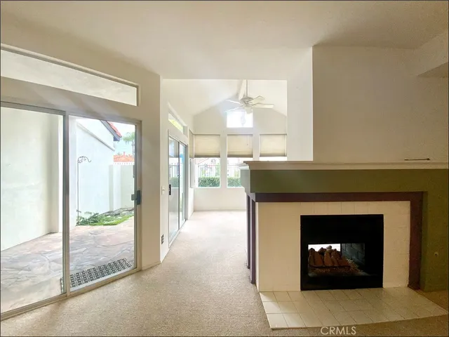 a room with a fireplace and a fireplace