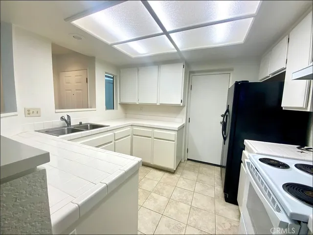 a bathroom with a double vanity sink and mirror