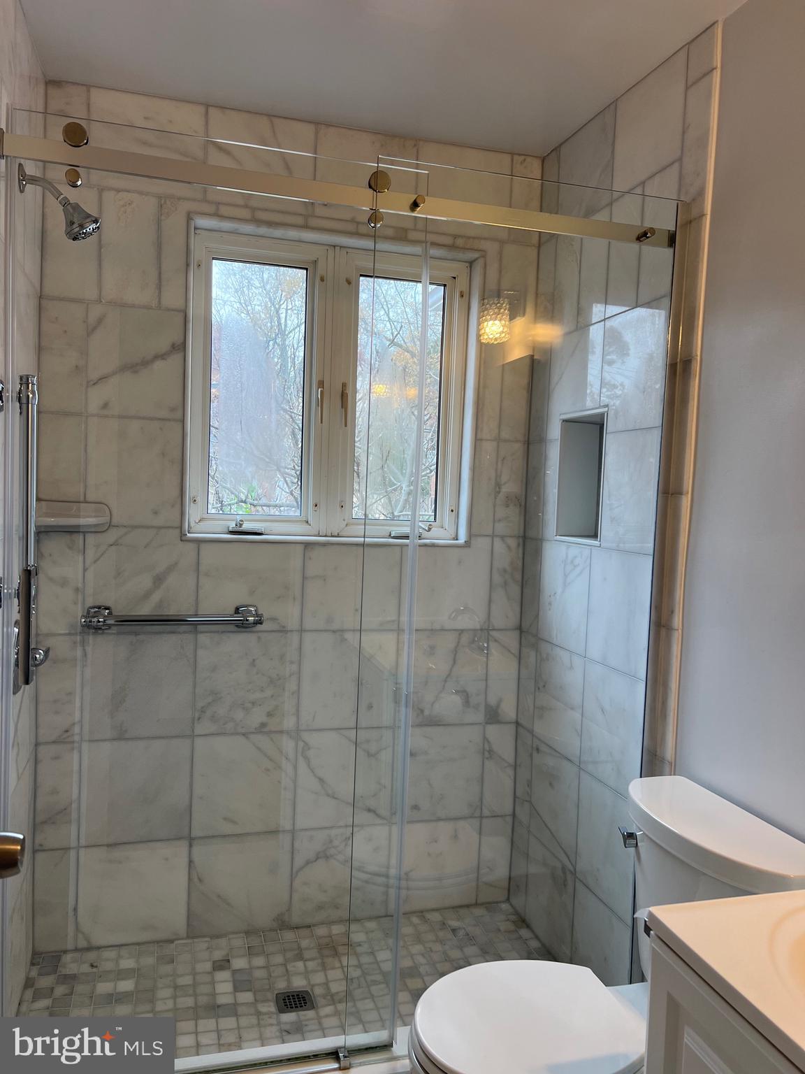 10713 St Margarets Way Silver Spring, MD 20902 - Photo 14 of 20 a bathroom with a toilet and shower