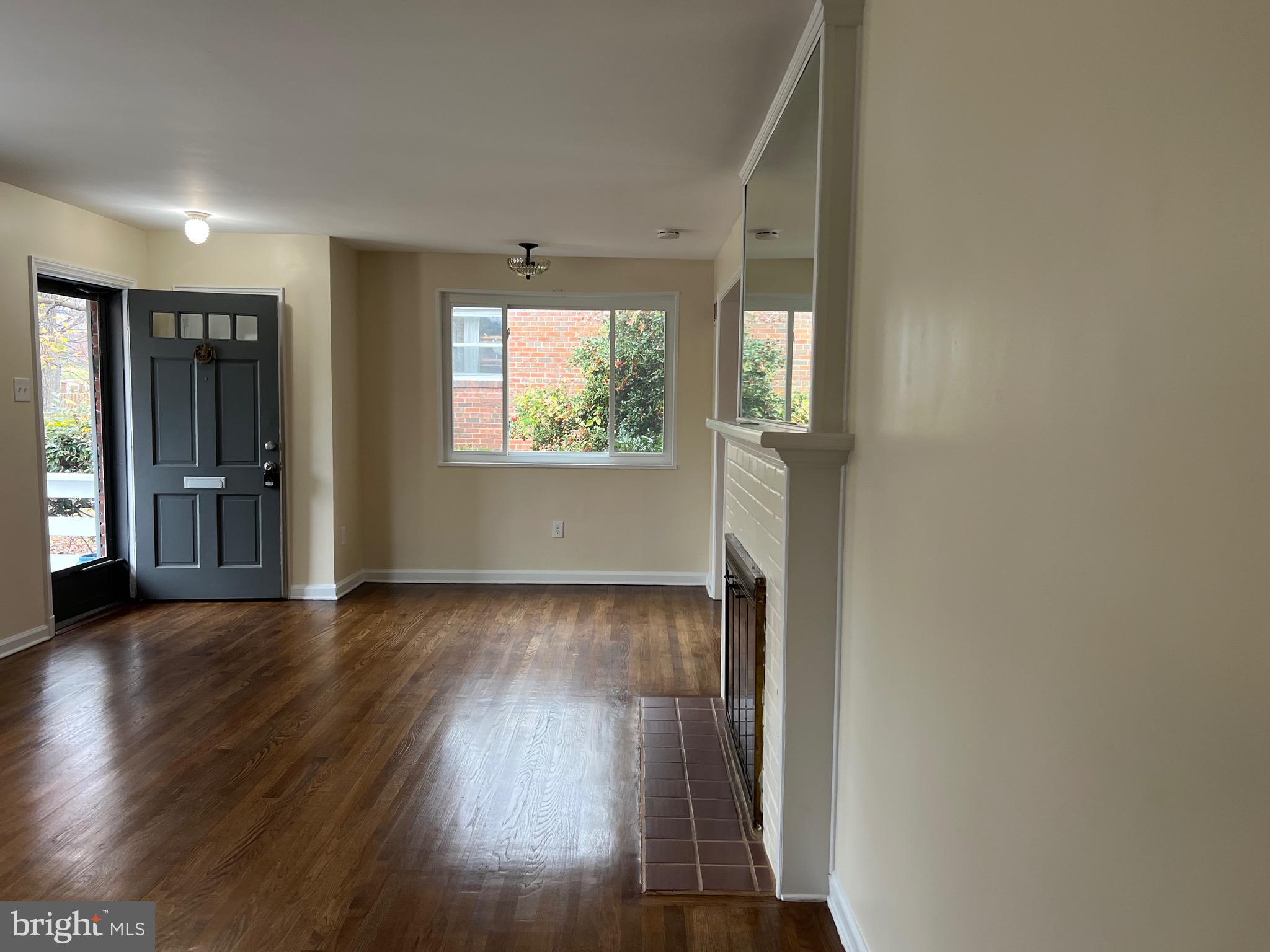 10713 St Margarets Way Silver Spring, MD 20902 - Photo 16 of 20 an empty room with wooden floor and windows