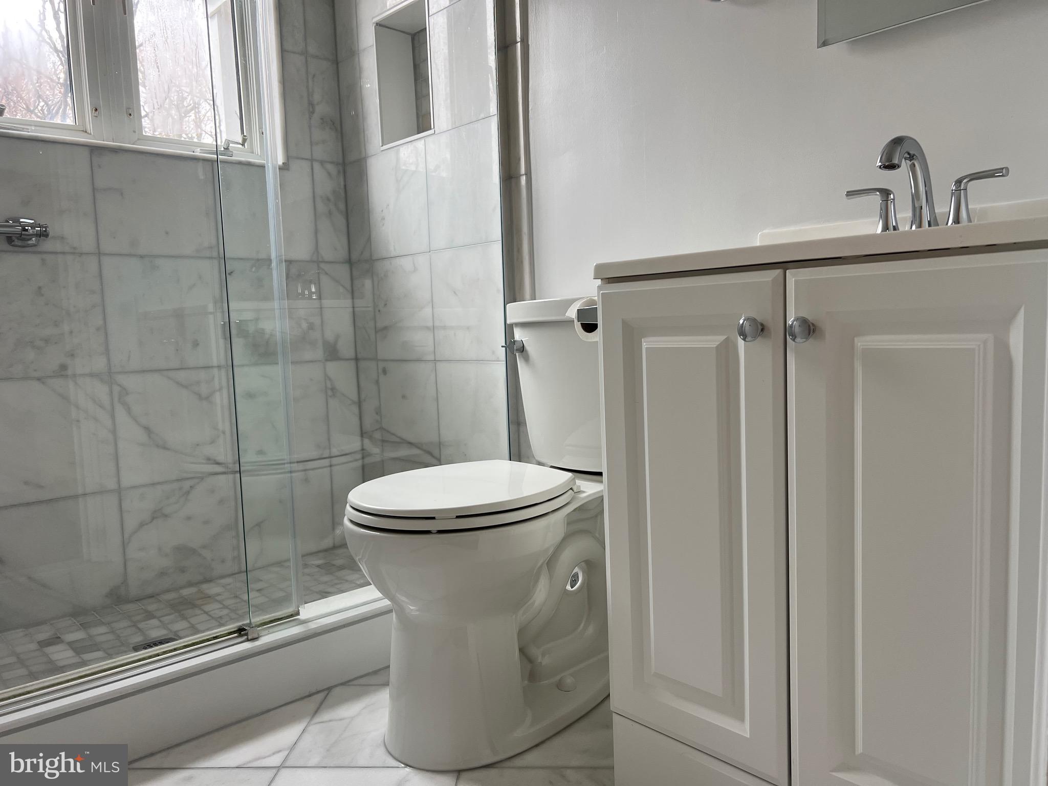 10713 St Margarets Way Silver Spring, MD 20902 - Photo 18 of 20 a bathroom with a toilet and a shower