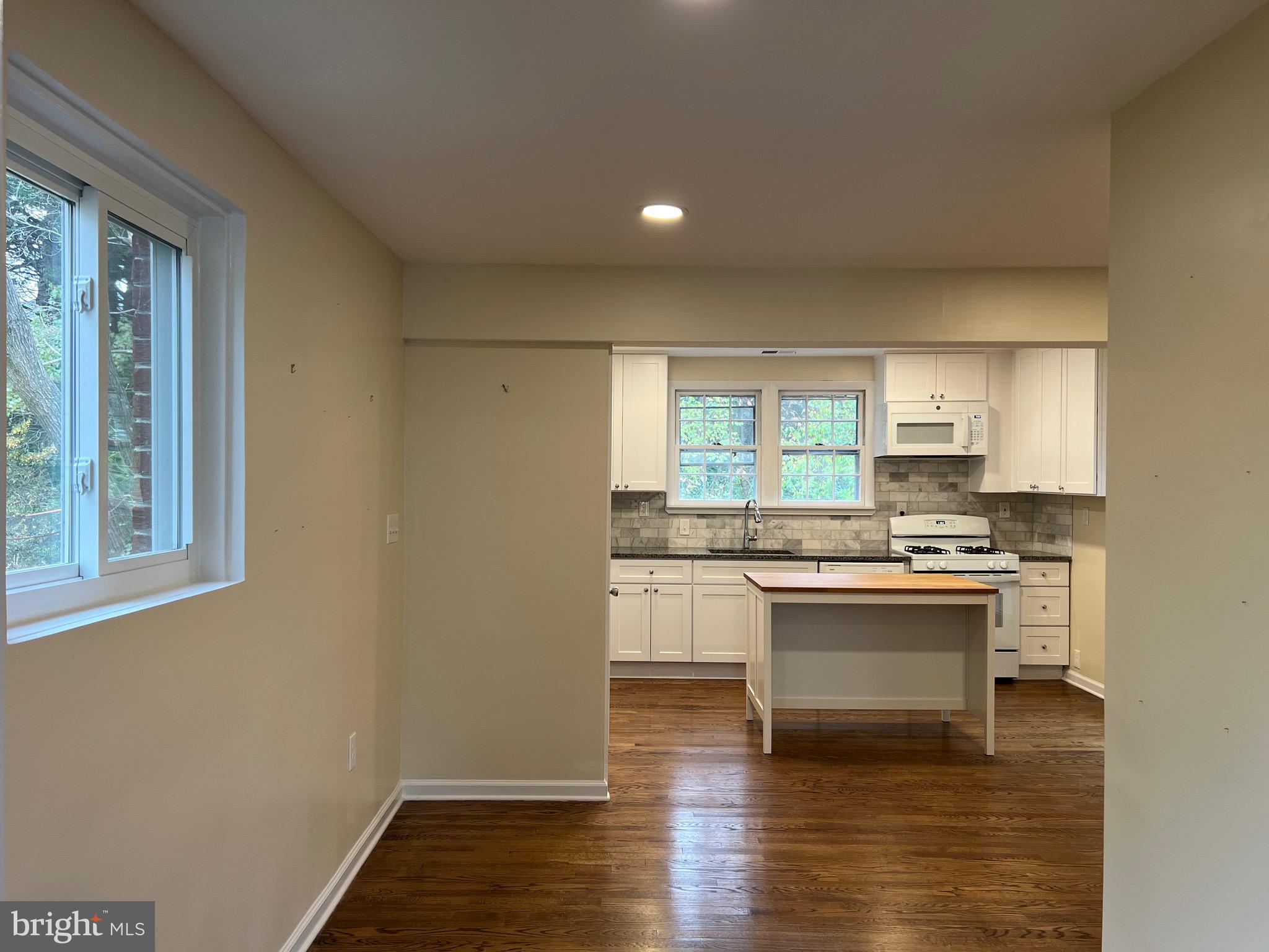 10713 St Margarets Way Silver Spring, MD 20902 - Photo 3 of 20 a kitchen with stainless steel appliances granite countertop a stove and a refrigerator