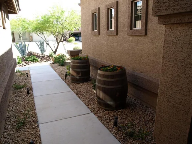 a backyard of a house with barbeque oven and a stove