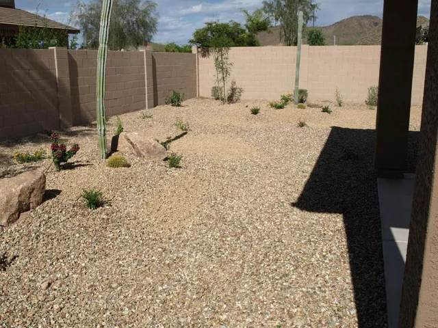 a view of a backyard of a house