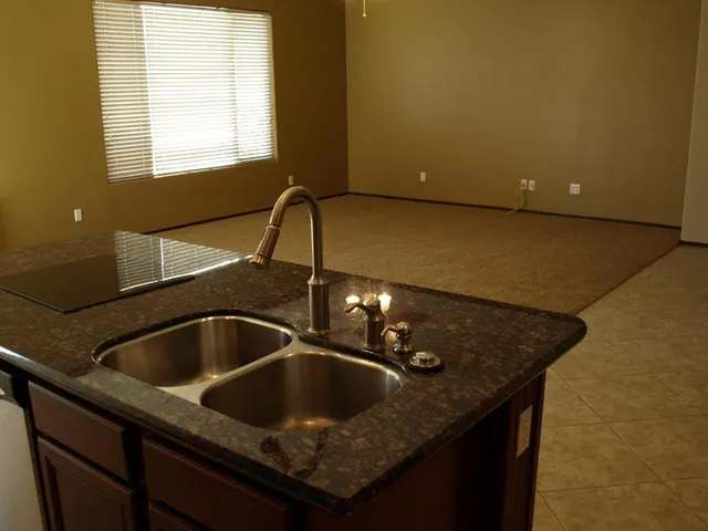 a kitchen with a sink and cabinets
