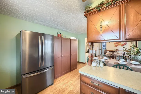 a kitchen with stainless steel appliances granite countertop a sink and stove top oven