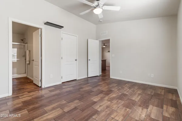 a view of an empty room and wooden floor