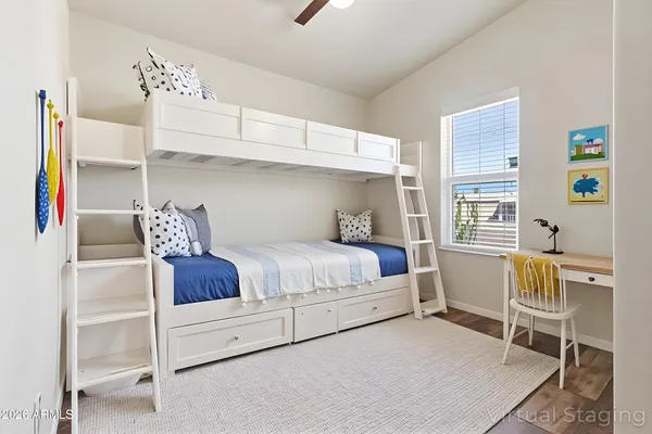 a bed room with a bed and chair