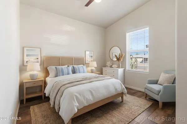 a bedroom with bed and a window