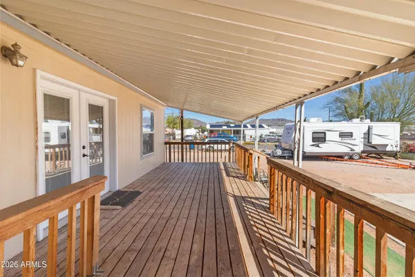 a view of balcony with wooden floor