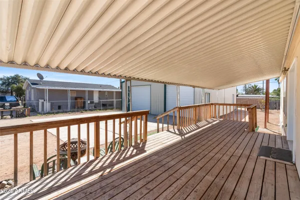 a view of balcony with wooden floor