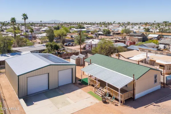 an aerial view of a house with a table and chairs