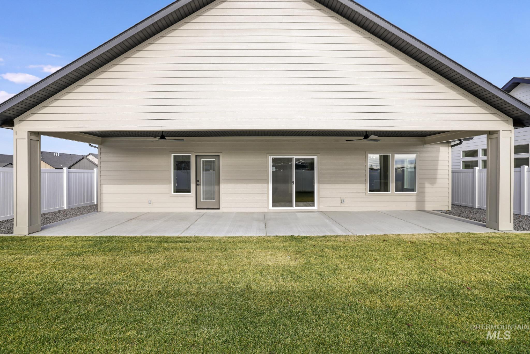 527 Falling Leaf Lane Twin Falls, ID 83301 - Photo 31 of 42 Rear view of property with a ceiling fan and a patio
