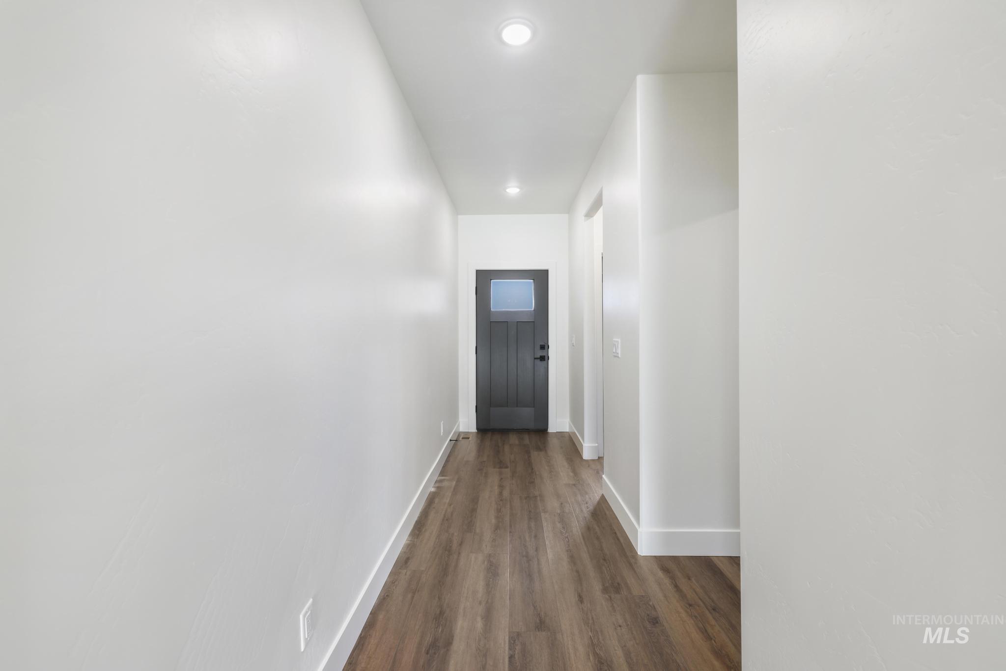 527 Falling Leaf Lane Twin Falls, ID 83301 - Photo 6 of 42 Hallway featuring dark wood-type flooring and recessed lighting