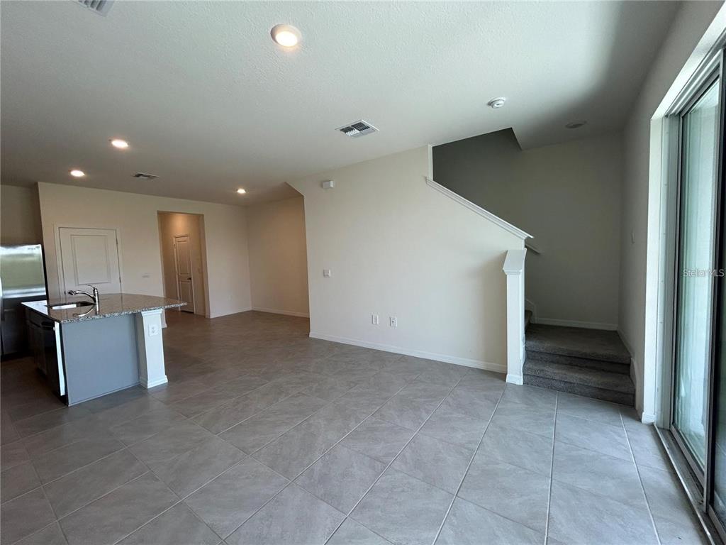 17550 Crescent Moon Loop Bradenton, FL 34211 - Photo 11 of 36 a view of an empty room with a window