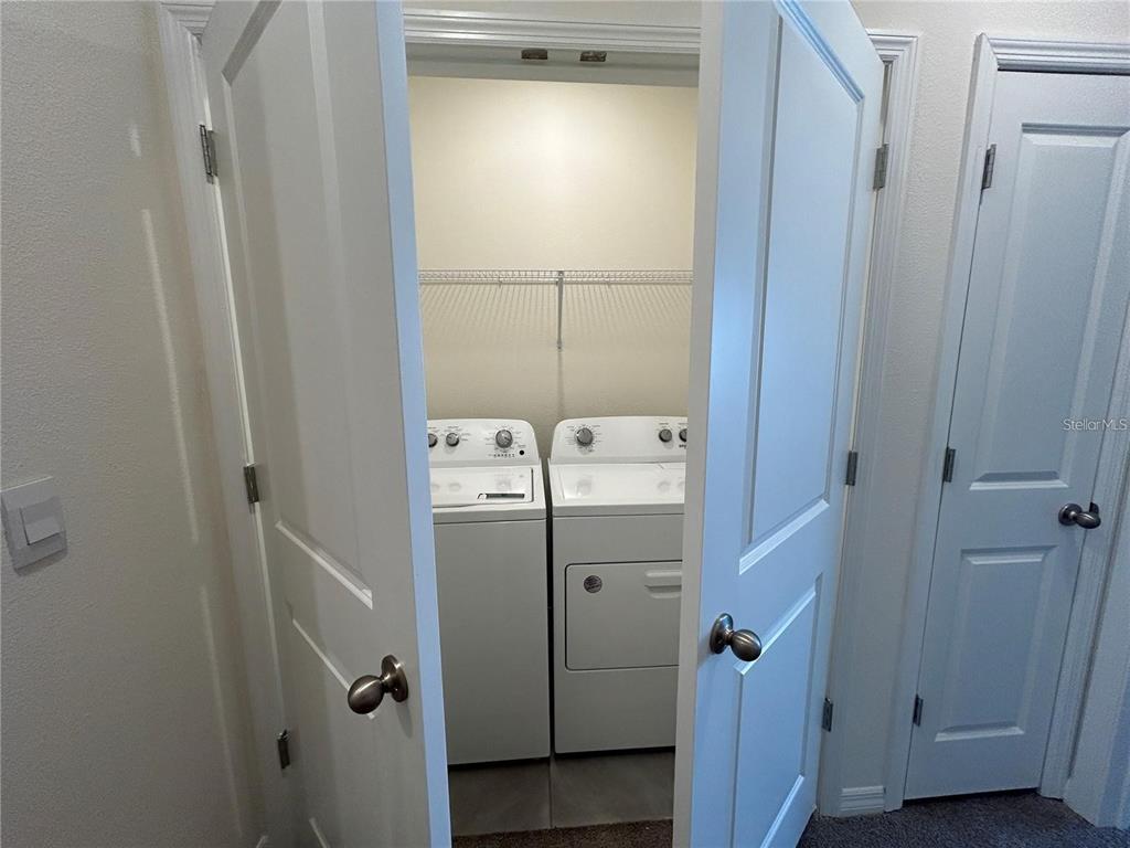 17550 Crescent Moon Loop Bradenton, FL 34211 - Photo 19 of 36 a room with storage and utility