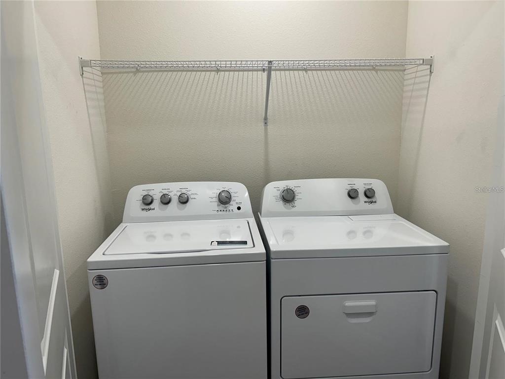 17550 Crescent Moon Loop Bradenton, FL 34211 - Photo 20 of 36 a utility room with dryer and washer