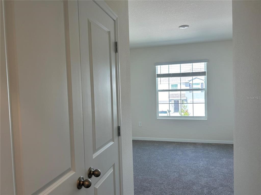 17550 Crescent Moon Loop Bradenton, FL 34211 - Photo 25 of 36 an empty room with windows