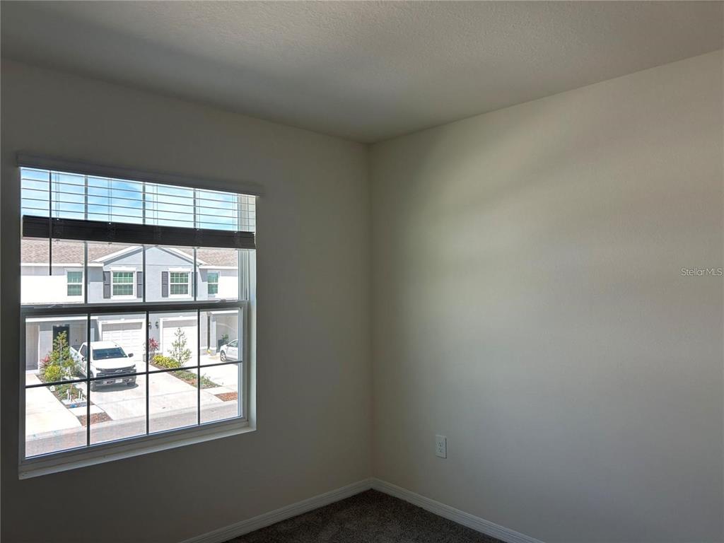 17550 Crescent Moon Loop Bradenton, FL 34211 - Photo 29 of 36 an empty room with a window