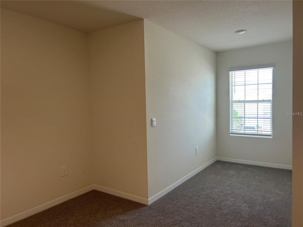 17550 Crescent Moon Loop Bradenton, FL 34211 - Photo 31 of 36 an empty room with a window
