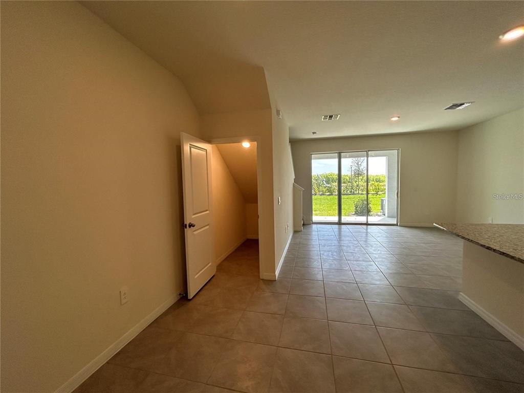 17550 Crescent Moon Loop Bradenton, FL 34211 - Photo 6 of 36 a view of an empty room with a window