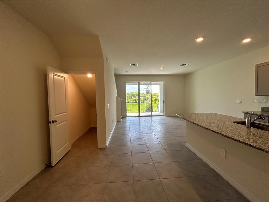 17550 Crescent Moon Loop Bradenton, FL 34211 - Photo 7 of 36 a view of a kitchen with a sink and a window