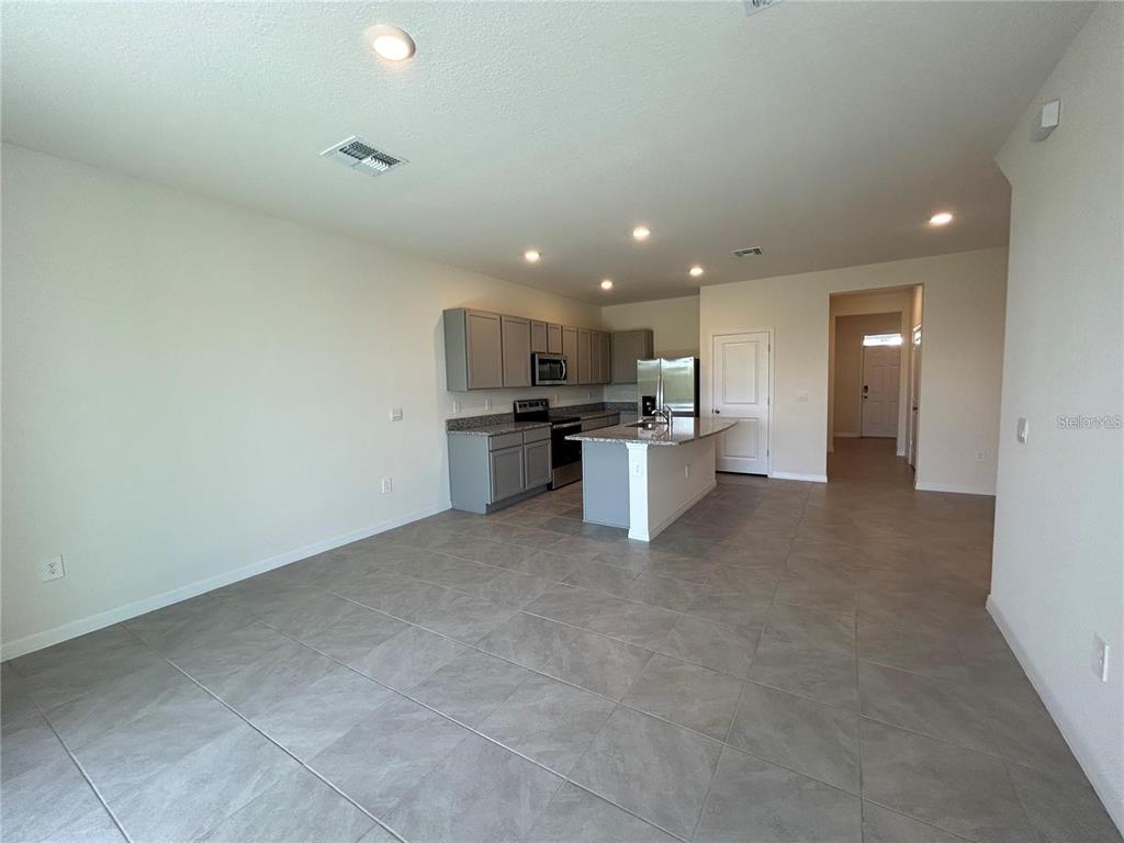 17550 Crescent Moon Loop Bradenton, FL 34211 - Photo 9 of 36 a view of a kitchen with a sink