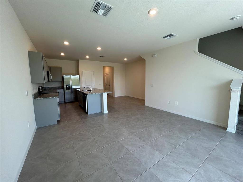 17550 Crescent Moon Loop Bradenton, FL 34211 - Photo 10 of 36 a view of a kitchen with a sink and microwave