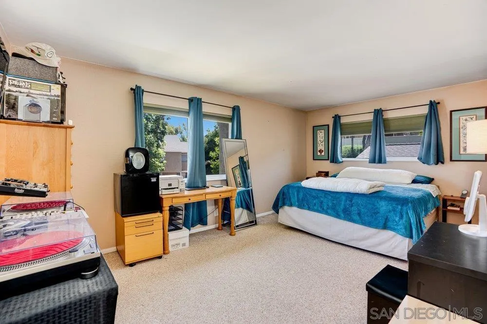 13358 Birch Tree Lane Poway, CA 92064 - Photo 12 of 16 a bedroom with a bed and wooden floor