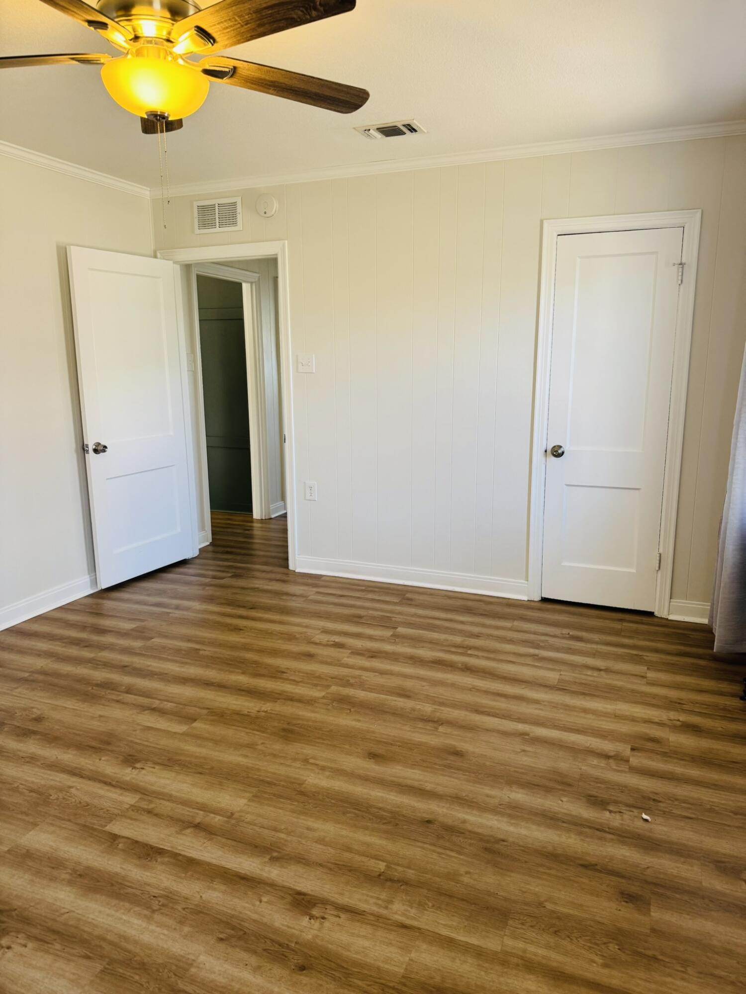 2701 27th Street Lubbock, TX 79410 - Photo 11 of 17 a view of a room with wooden floor