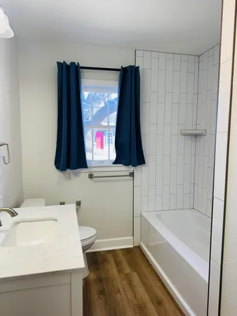 a bathroom with a sink toilet and tub