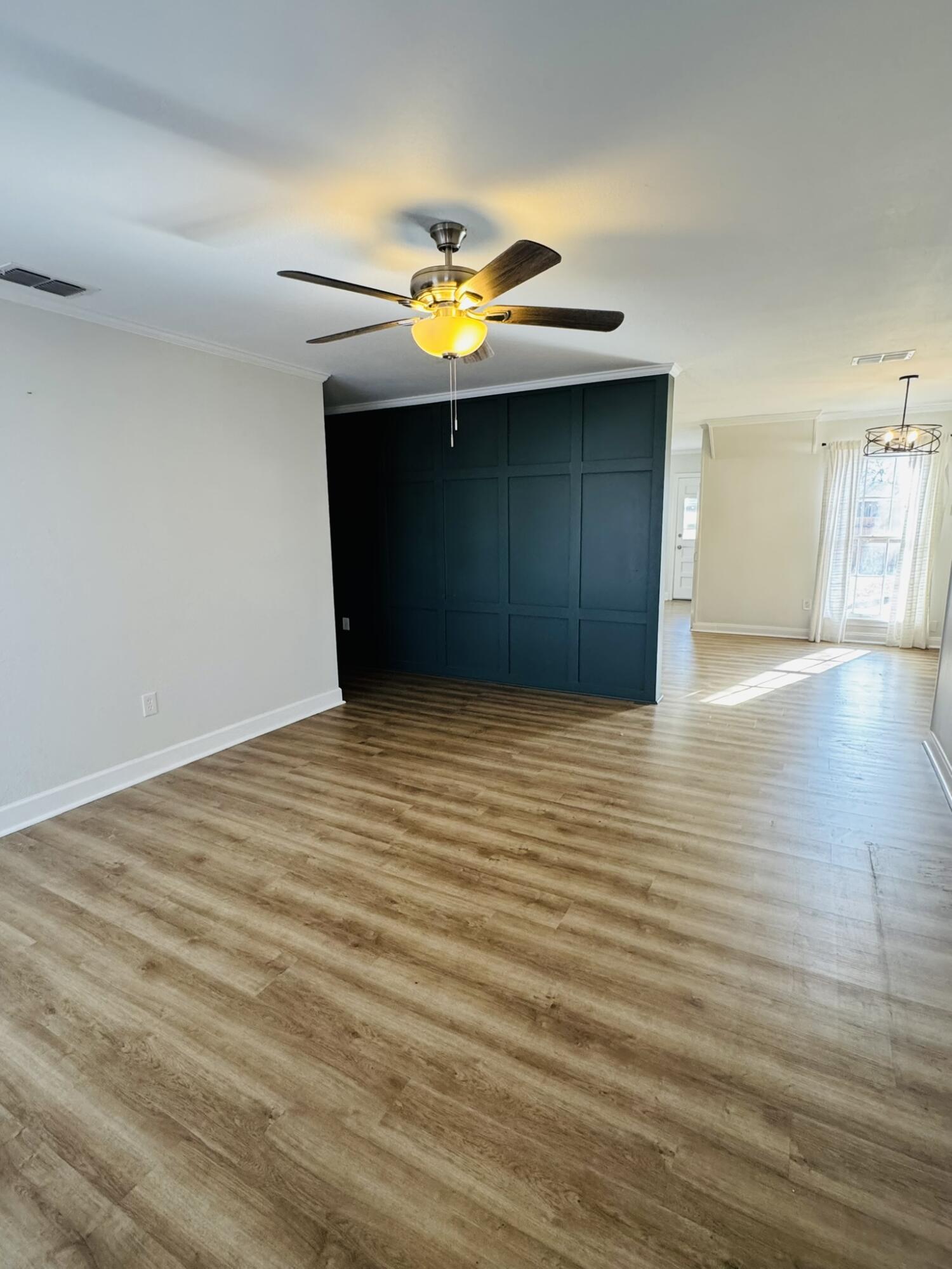 2701 27th Street Lubbock, TX 79410 - Photo 3 of 17 a view of an empty room with wooden floor