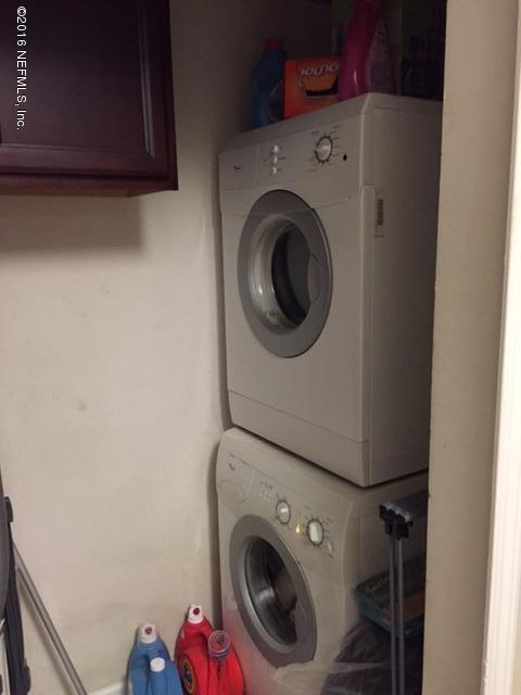 7920 Merrill Road, Unit 606 Jacksonville, FL 32277 - Photo 5 of 7 a utility room with dryer and washer