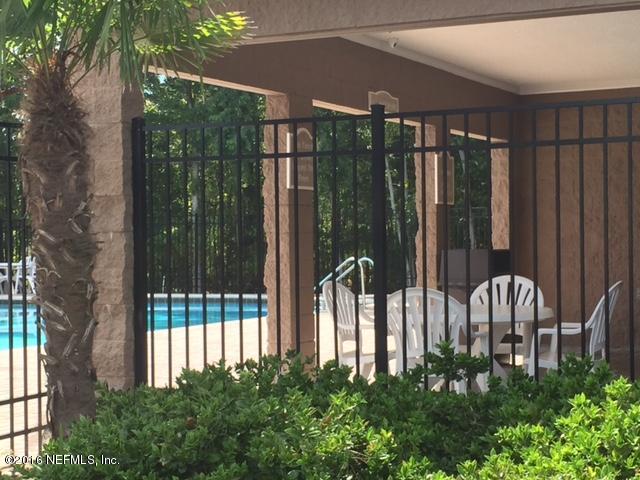 7920 Merrill Road, Unit 606 Jacksonville, FL 32277 - Photo 7 of 7 a view of a backyard with garden