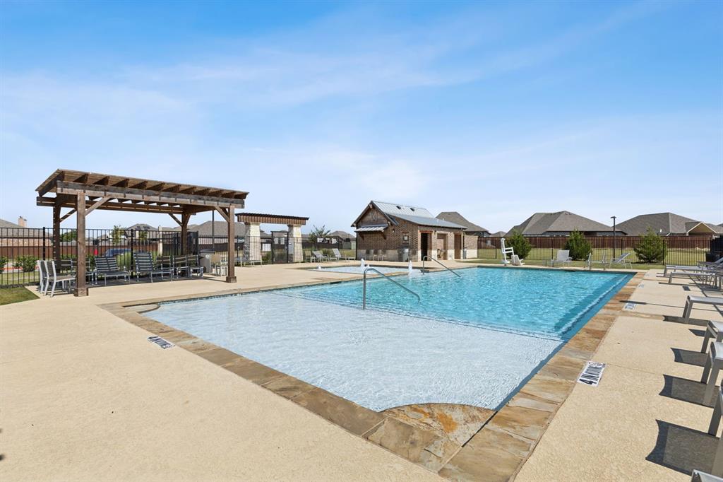 507 Pinnacles Court Forney, TX 75126 - Photo 30 of 31 a view of a swimming pool with a yard