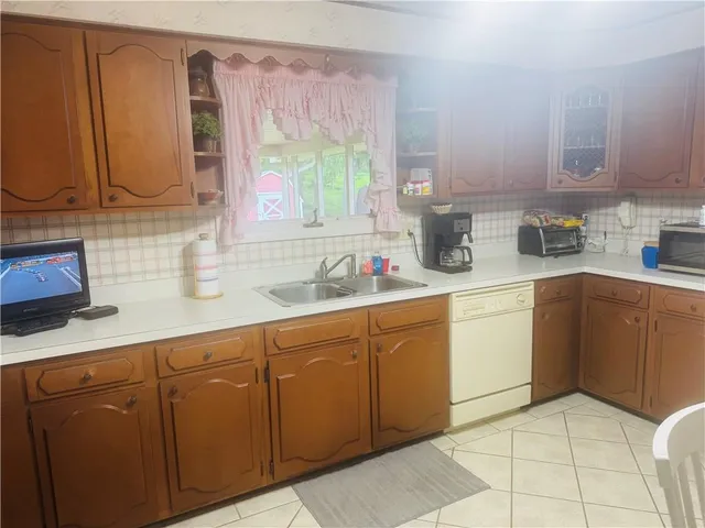 a kitchen with cabinets and appliances