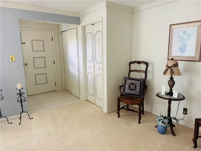 a view of a livingroom with furniture and a window
