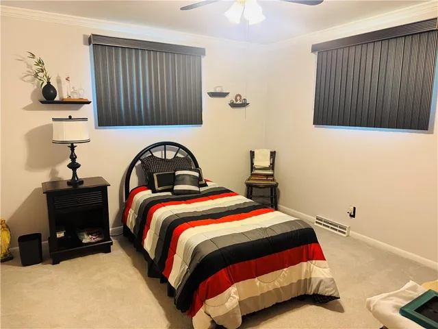 a bedroom with a bed and a cabinets